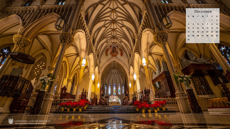 The interior of the cathedral decorated with red poinsettias